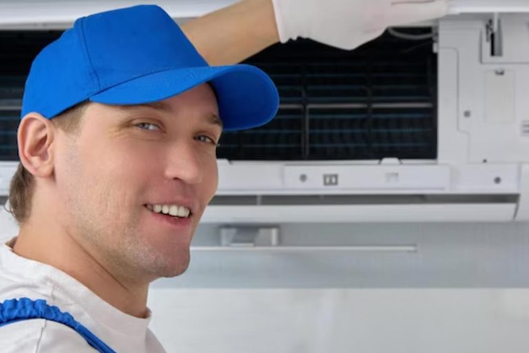 AC Service New Lenox - Worker with ac unit working well - Happy Hippo Heating and Cooling