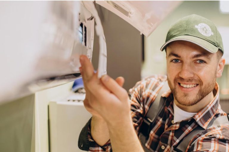 AC Service New Lenox - Worker with ac unit working well - Happy Hippo Heating and Cooling